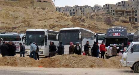 20 حافلة لاخراج حوالي 1053 من المسلحين وعائلاتهم كدفعة ثالثة من حي برزة باتجاه ادلب 