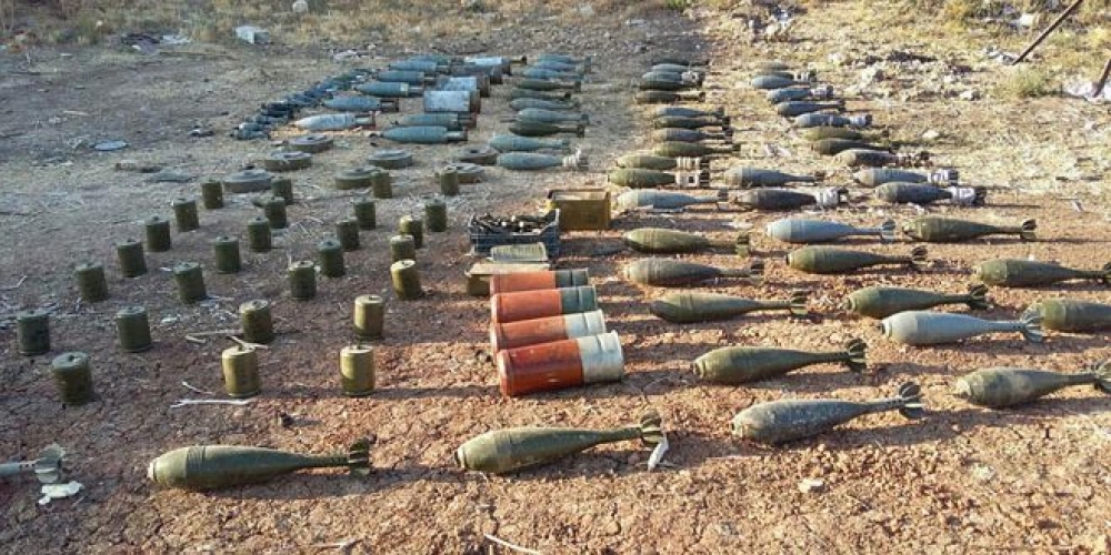 أسلحة وألغام من مخلفات الإرهابيين في مزارع قرية الأربعين بريف حماة الشمالي