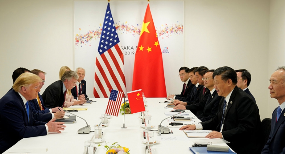 الصين: اتصالات وثيقة مع أمريكا بشأن حفل توقيع اتفاق التجارة