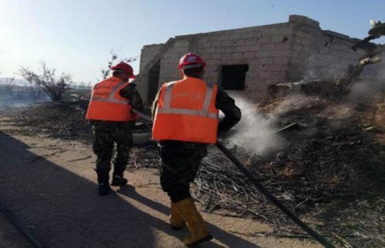 إخماد حريقين نشبا في حقول الزيتون والقمح والسرو بريف حمص