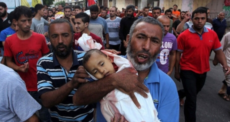 With more bodies pulled from under the rubble, Gaza death toll tops 1,000