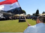 العلم السوري يتقدم تشييع جثمان الشاعر سميح القاسم في الرامة
