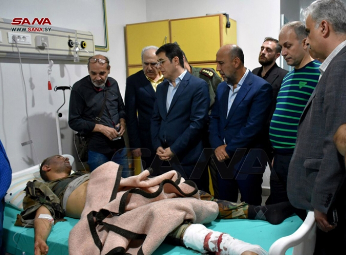 وزير الصحة يتابع حالة المصابين والجرحى جراء العمل الإرهابي الذي استهدف الكلية الحربية بحمص