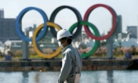 طوكيو ملتزمة بإقامة الألعاب الأولمبية في موعدها وتنفي التقارير عن إلغائها