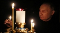 بوتين يضيء شمعة حداداً على أرواح ضحايا هجوم كروكوس الإرهابي