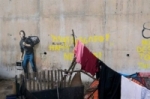 فرنسا تقرر حماية جدارية تصور ستيف جوبز في مخيم للاجئين